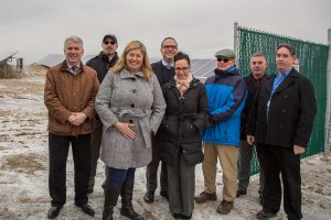 A group photo of district officials at the solar project.