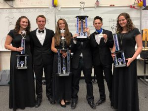 Band students show off their trophees