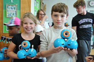 HS & elementary students “buddy up” for a hands-on robotics lesson