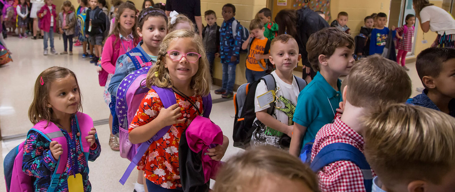 a school hallway of kindergarten students on the first day of school