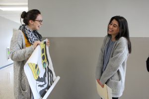 Naya Vasquez being presented with an enlargement of her winning artwork