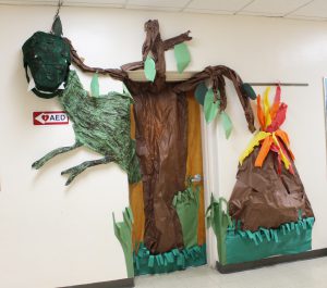 Classroom door decorated with dinosaur art