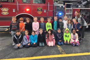 Elementary students learn fire safety and prevention from their firefighting neighbors