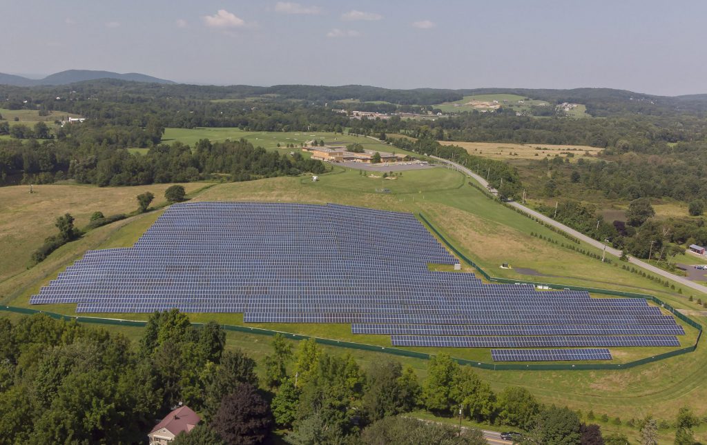 The district's solar array is located on a field downhill from Sanfordville Elementary.