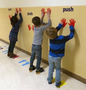 students in the sensory path hallway