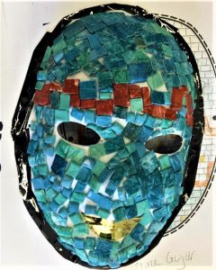 A mask designed with small tiles of different colors.