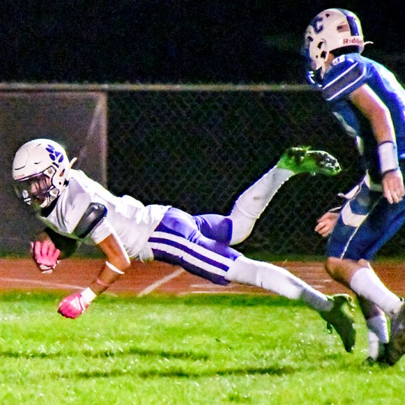 Wildcats receiver dives ahead for a first down