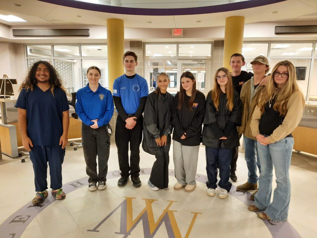 Nine CTE students lined up in library who attend both WVHS and OU BOCES programs