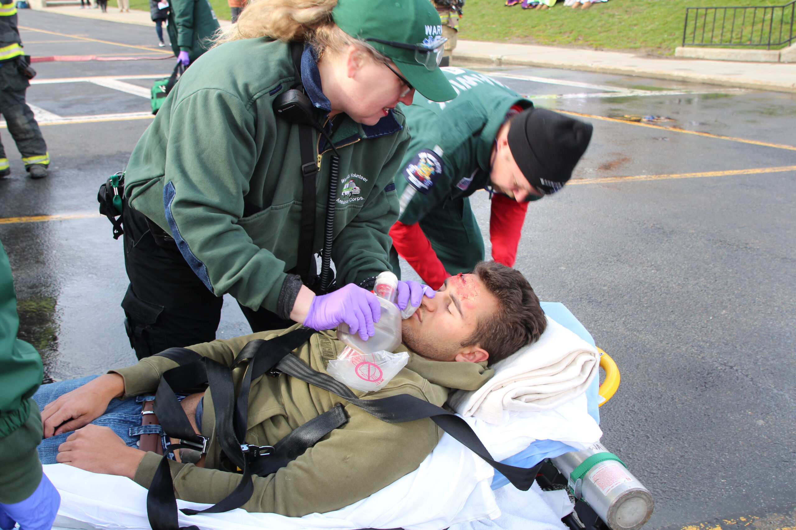 EMS workers aid a victim of a mock automobile crash at Warwick Valley High School.