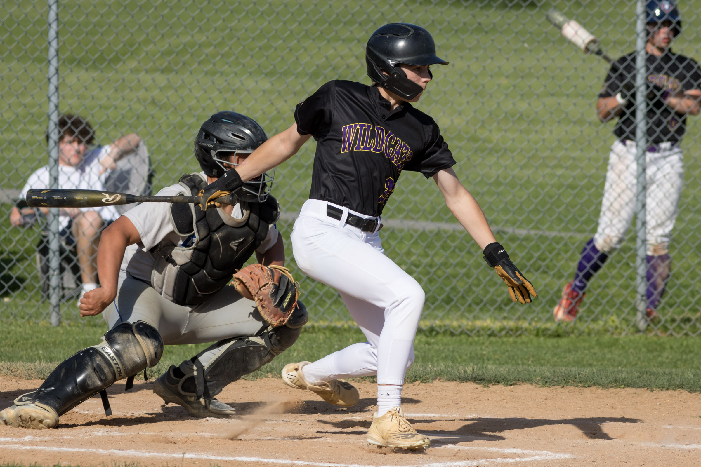 A Warwick Valley High School varsity baseball batter follows through on his swing.