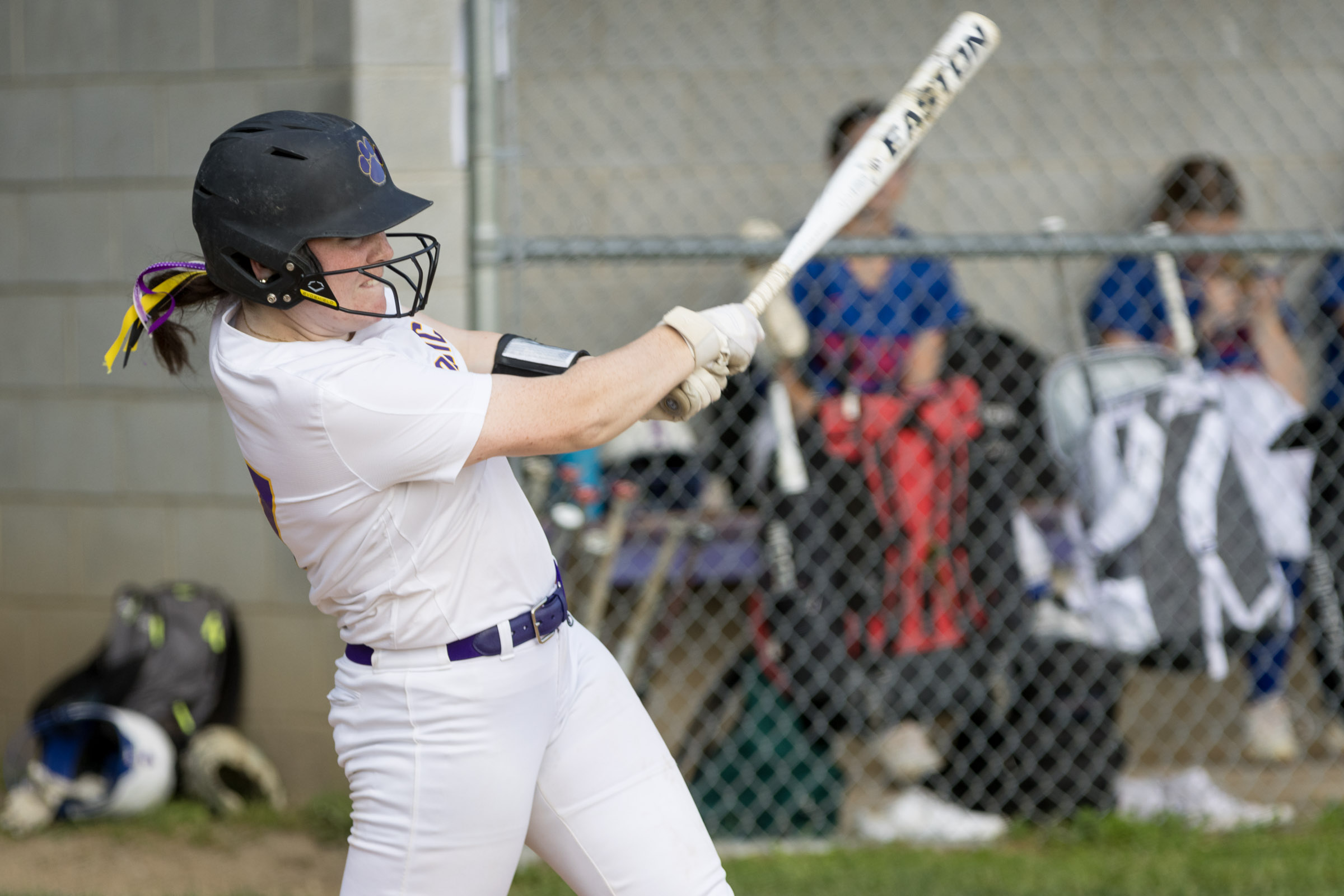 A Warwick Valley High School varsity softball batter follows through on her swing.