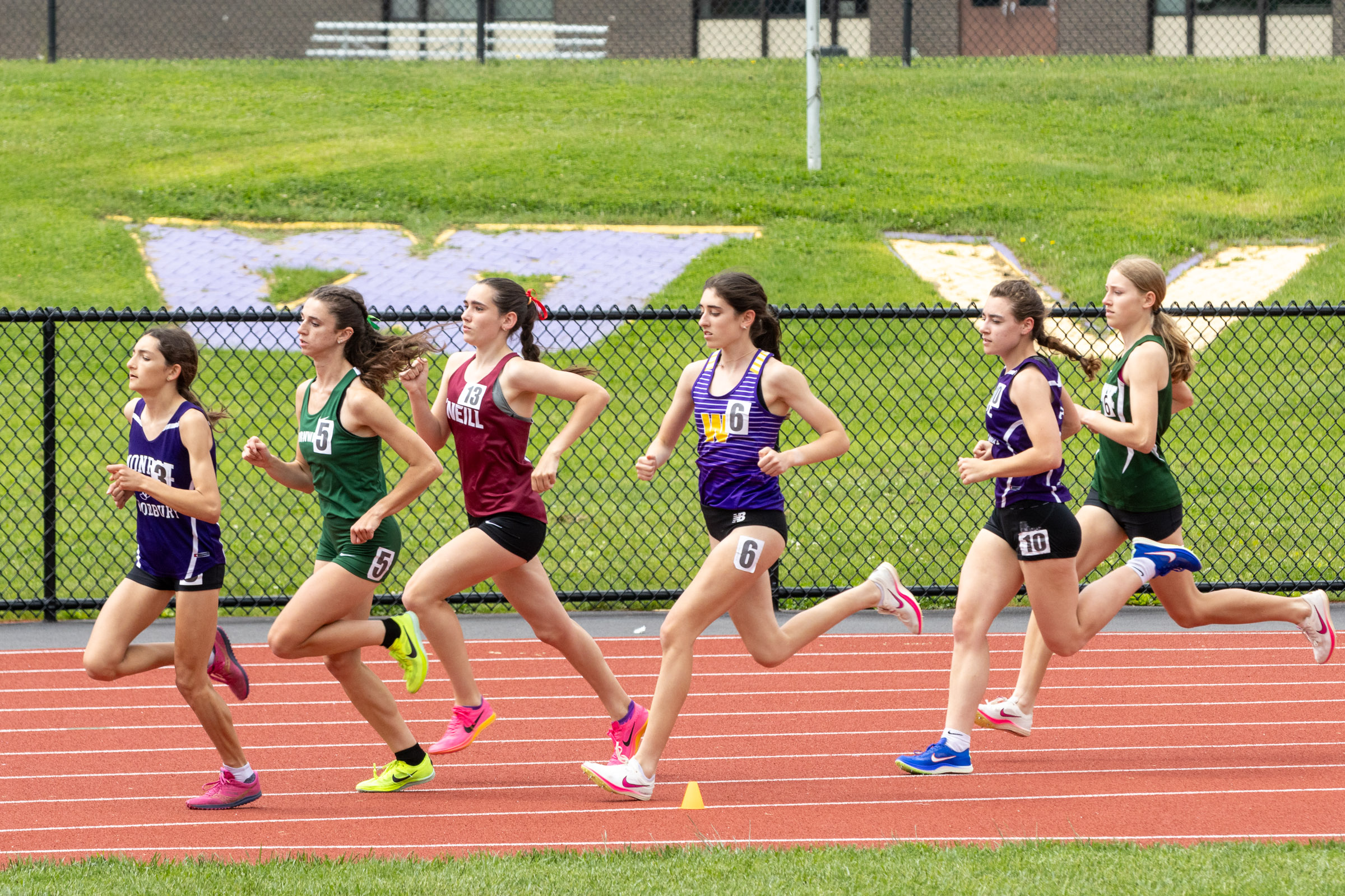 Athletes run a race on day one of the OCIAA track and field championship meet at Tim St. Lawrence track.