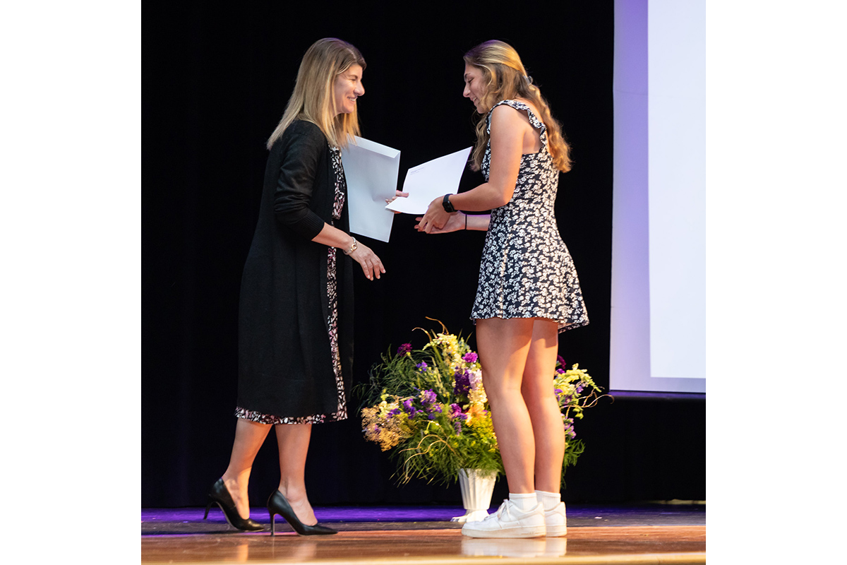 A student receives an award on the auditorium stage during Warwick Valley High School's 51st annual Awards Ceremony.