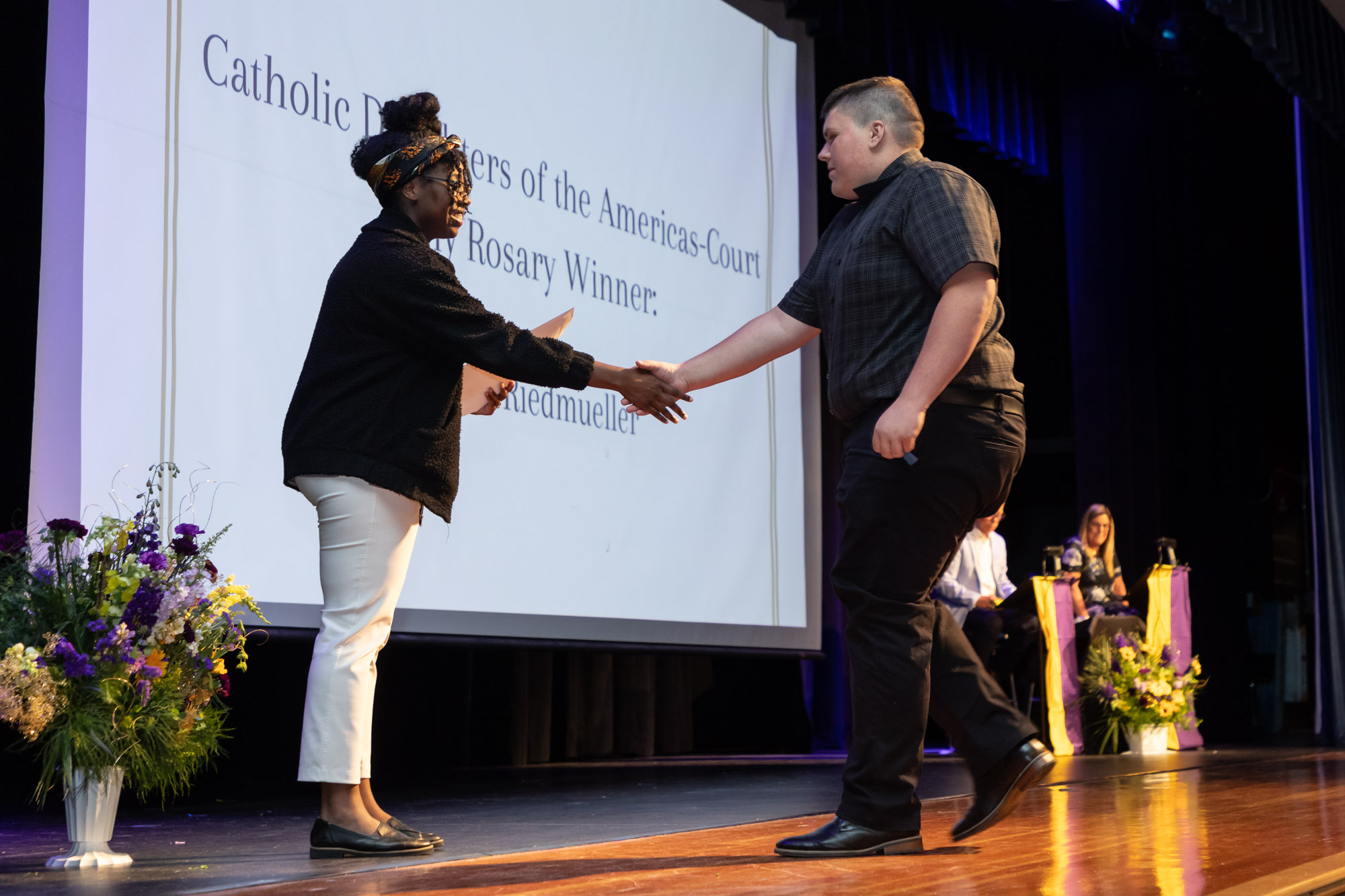 A student receives an award on the auditorium stage during Warwick Valley High School's 51st annual Awards Ceremony.