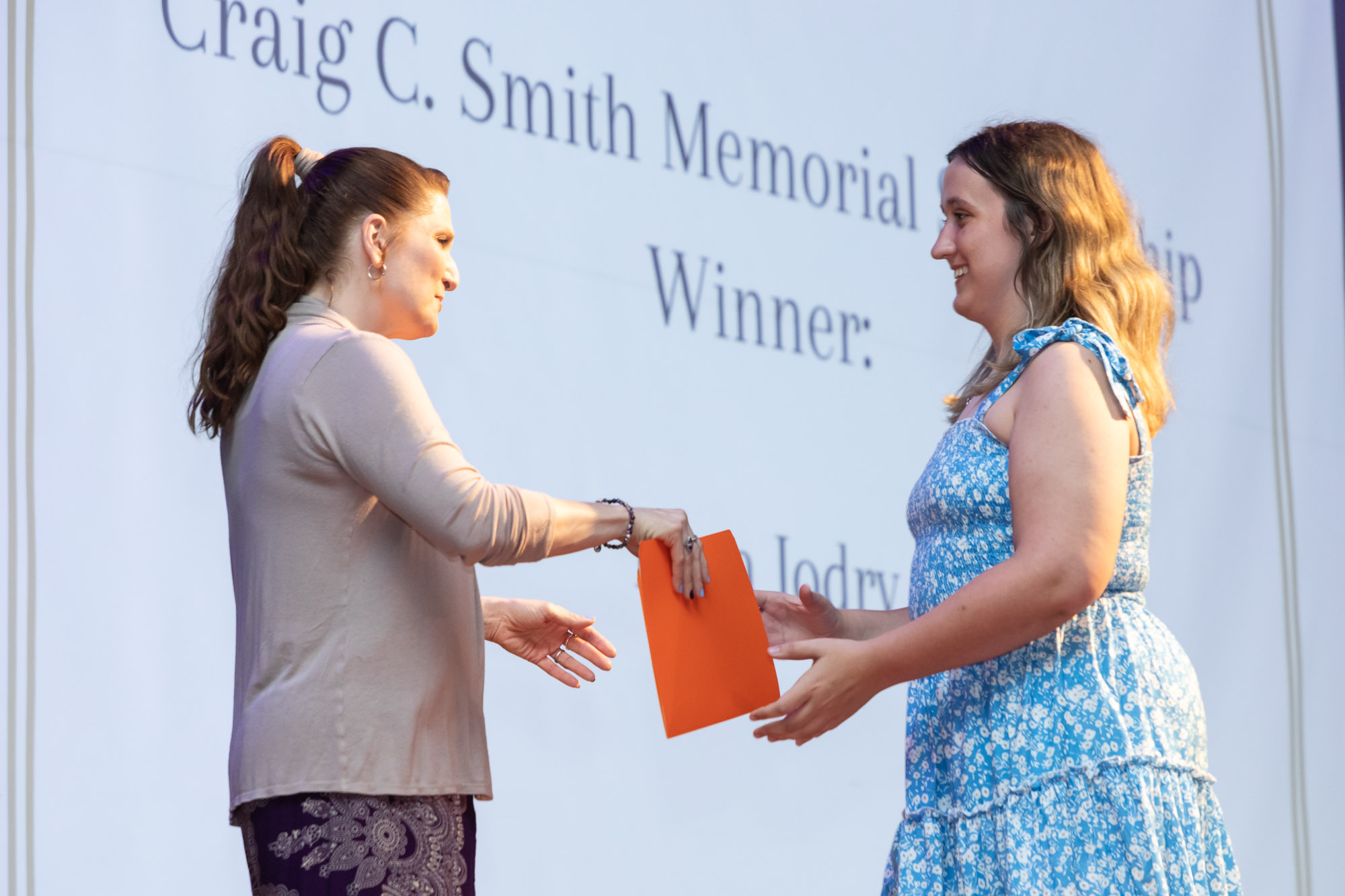 A student receives an award on the auditorium stage during Warwick Valley High School's 51st annual Awards Ceremony.