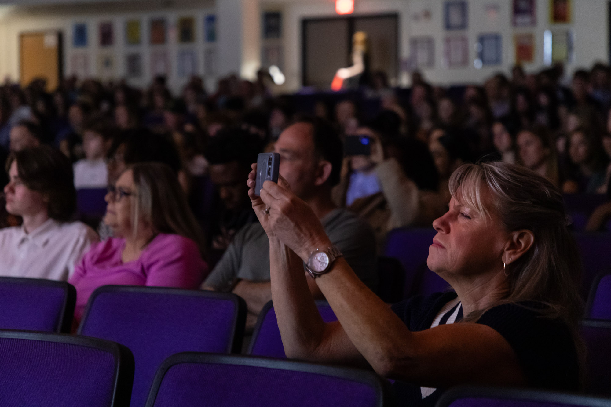 A woman takes a photo with her cell phone during Warwick Valley High School's 51st annual Awards Ceremony.