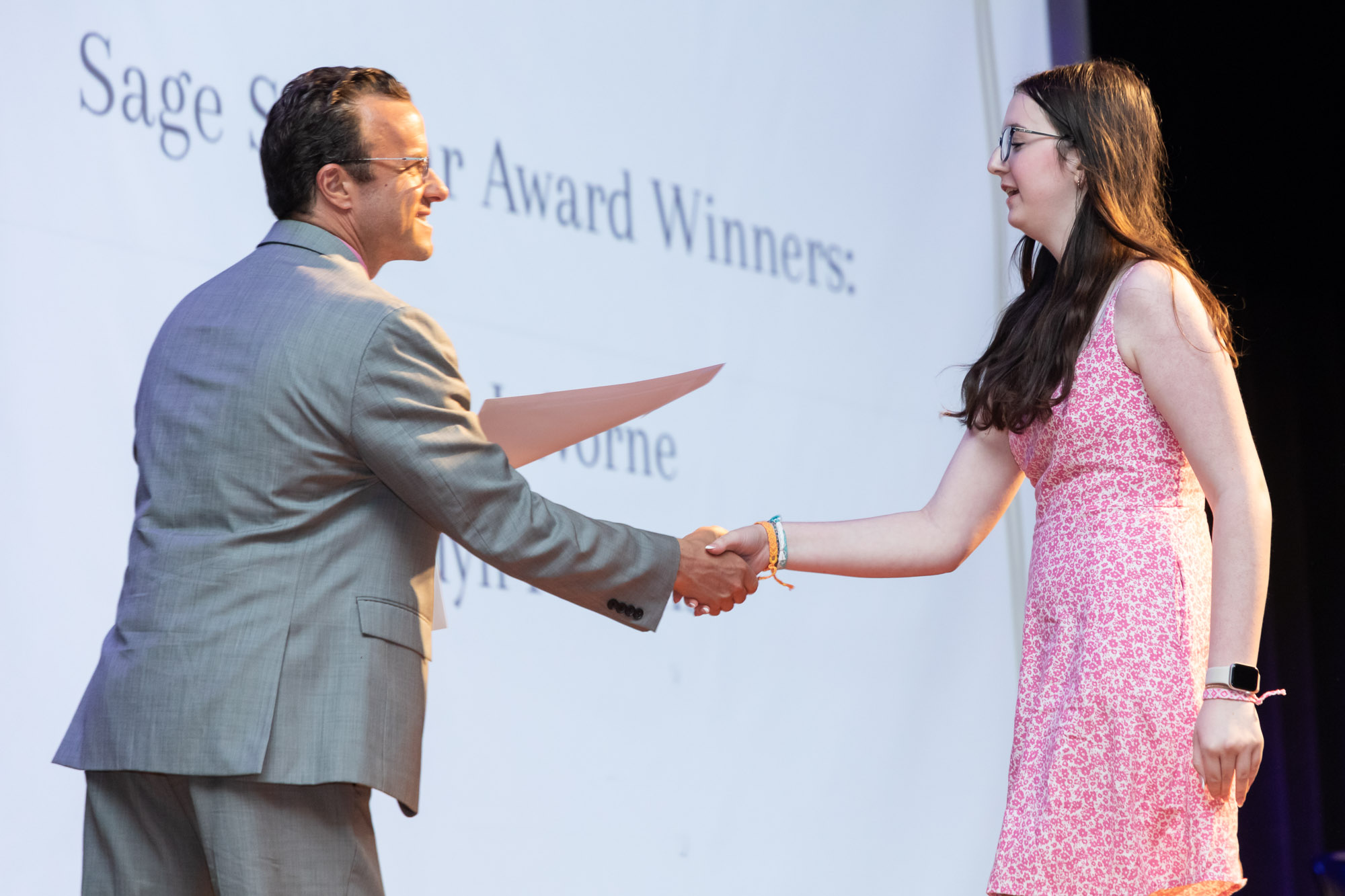 A student receives an award on the auditorium stage during Warwick Valley High School's 51st annual Awards Ceremony.