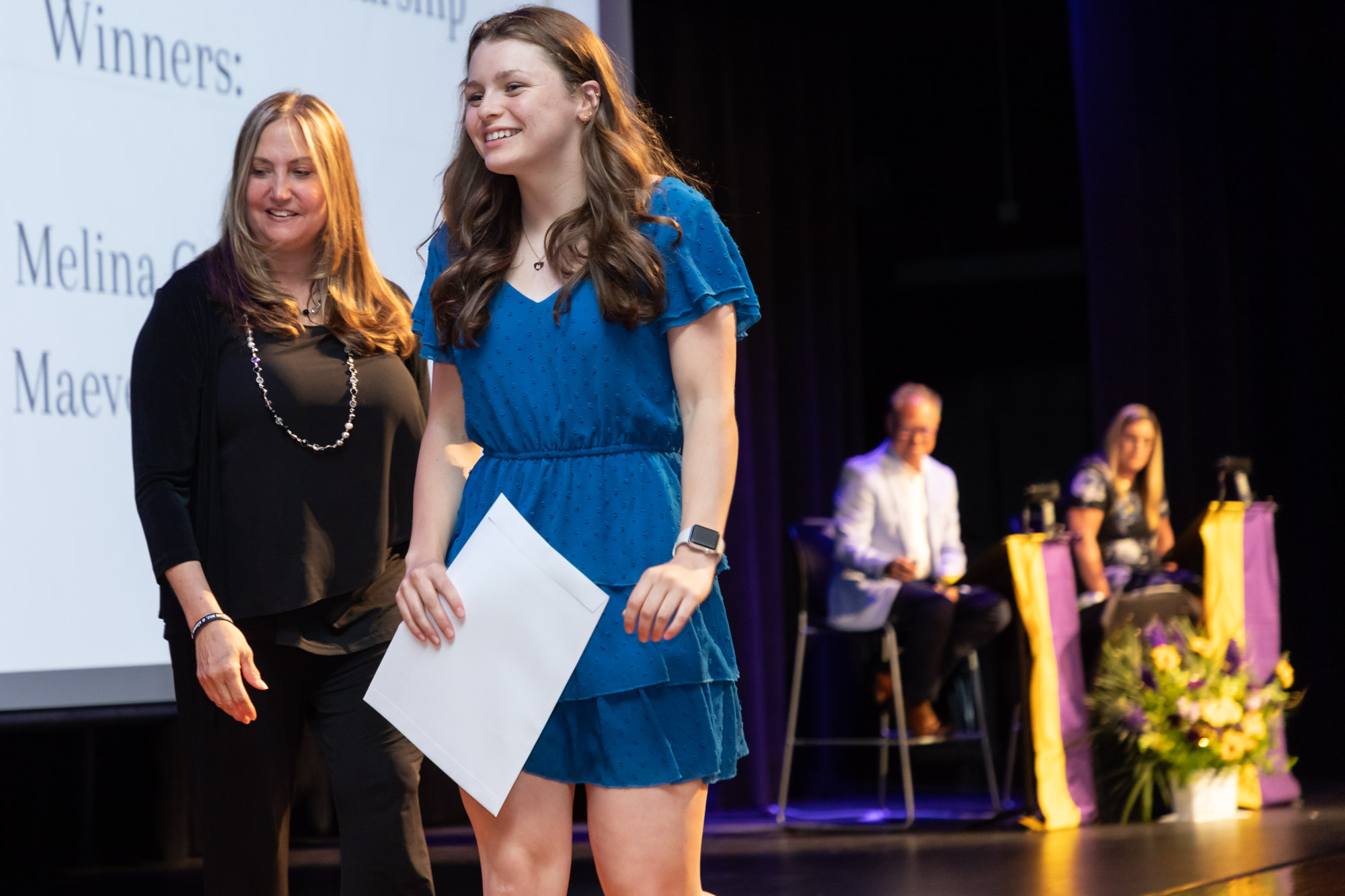 A student receives an award on the auditorium stage during Warwick Valley High School's 51st annual Awards Ceremony.