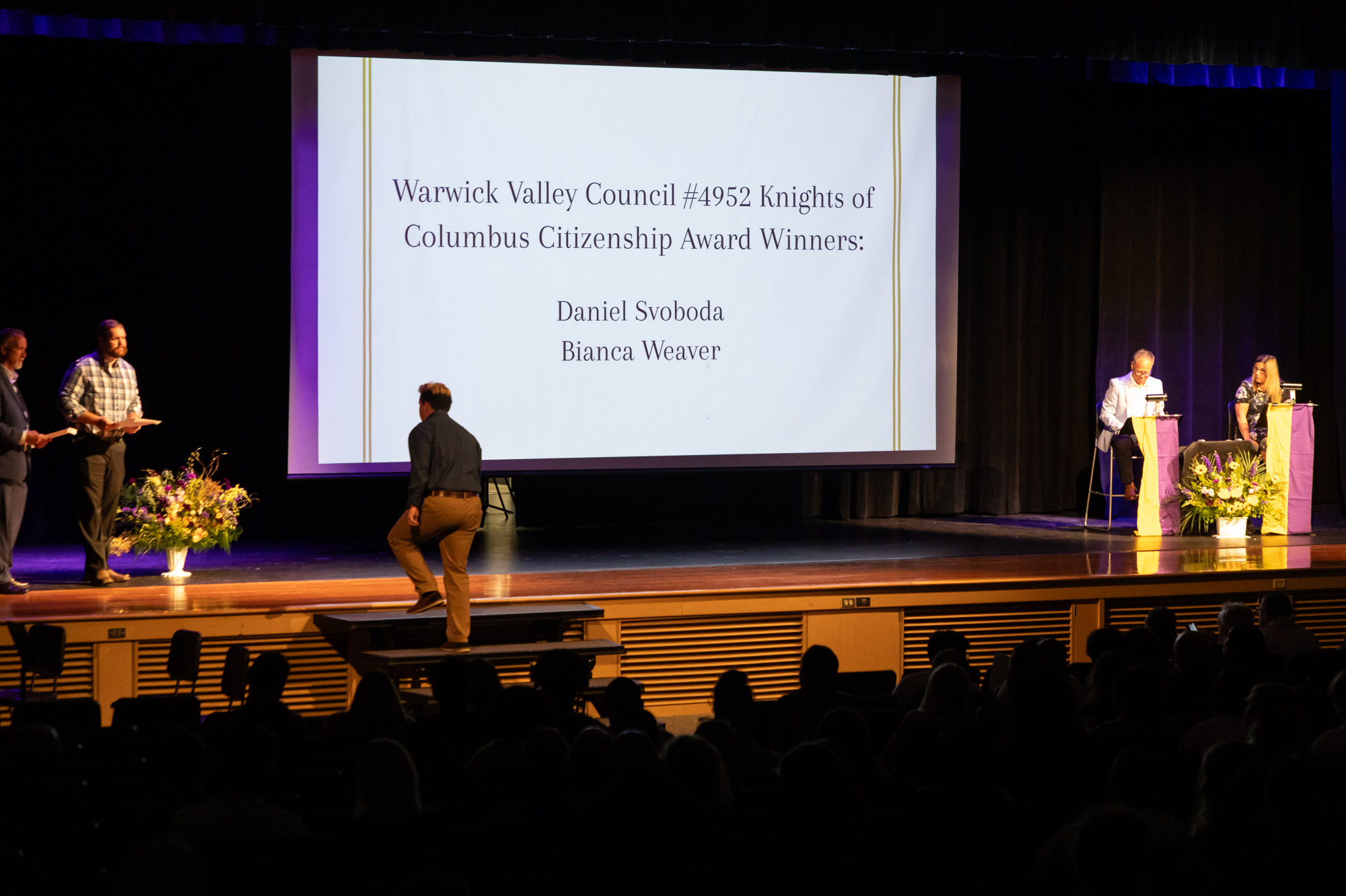 A student steps up to the stage to receive an award during Warwick Valley High School's 51st annual Awards Ceremony.