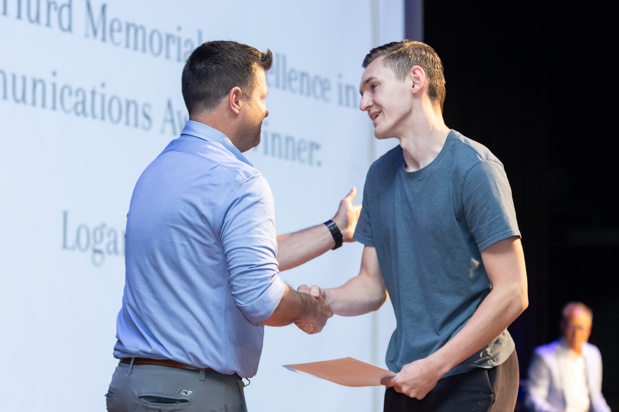 A student receives an award on the auditorium stage during Warwick Valley High School's 51st annual Awards Ceremony.