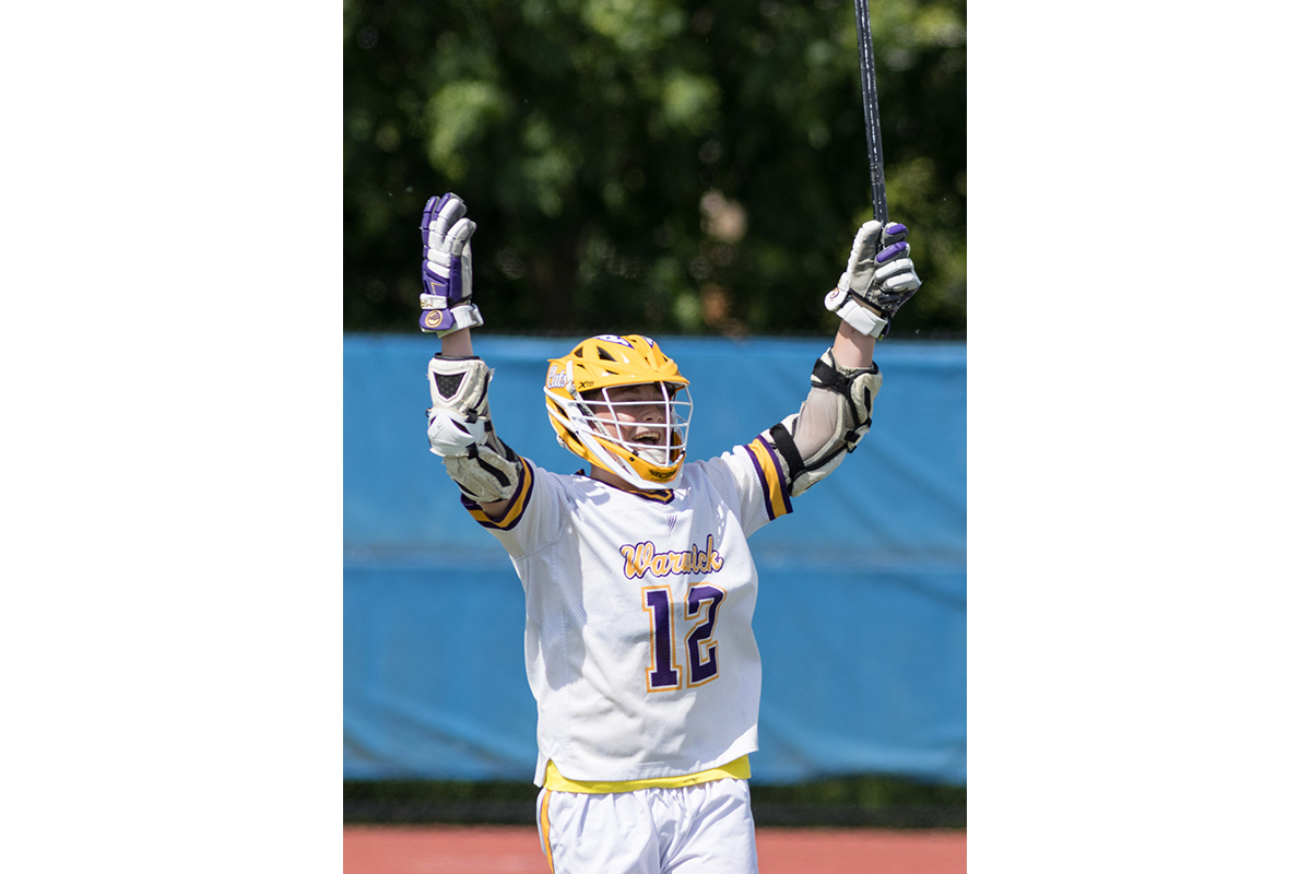 A Warwick Valley varsity boys lacrosse player celebrates a goal against Minisink Valley player during the Section 9 Class B championship game.