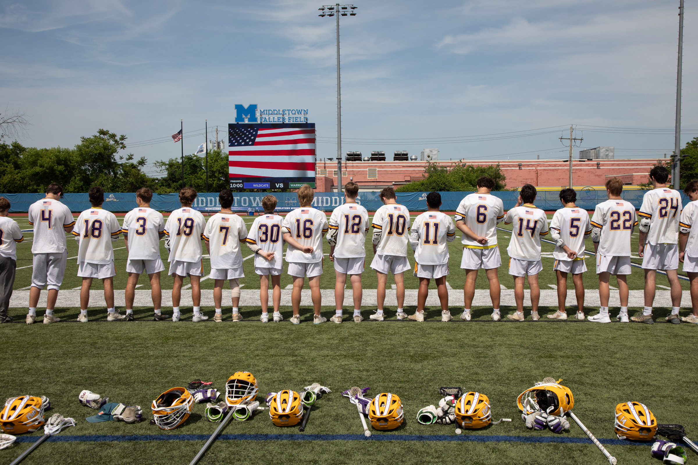 The Warwick Valley varsity boys lacrosse team stands on the field before the Section 9 Class B championship game at Middletown's Faller Field.