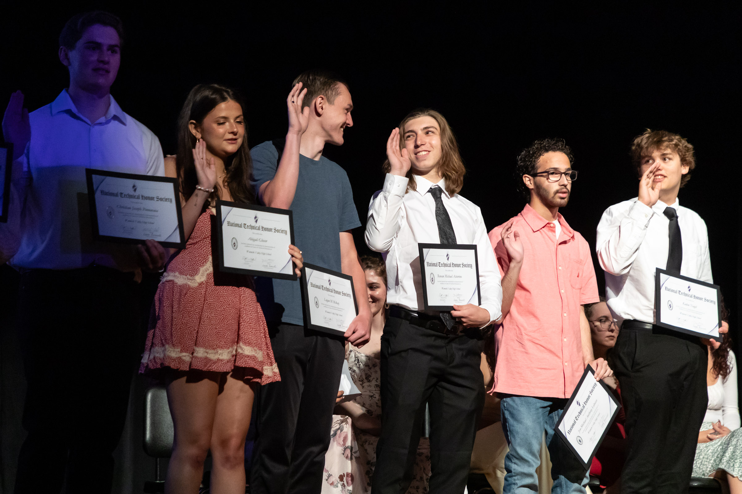 Students hold their NTHS certificates on stage during the Warwick Valley High School Career and Technical Education Recognition Ceremony and Honor Society Induction Ceremony and Honor Society Induction on June 11, 2024.