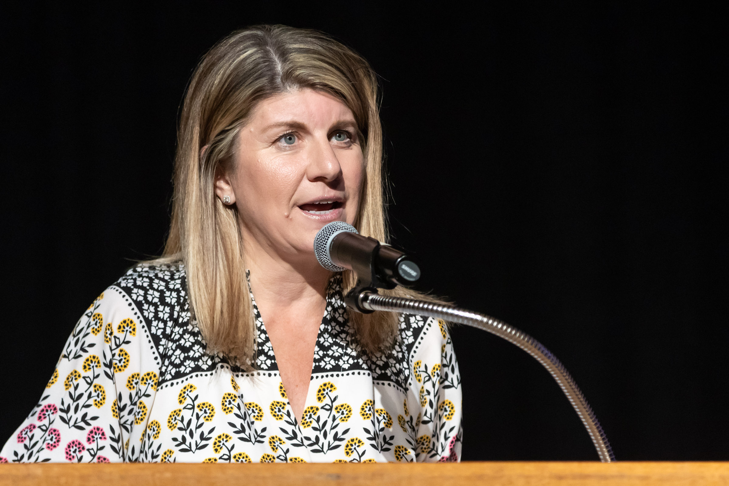 Principal Georgianna Diopoulos speaks at the podium during the Warwick Valley High School Career and Technical Education Recognition Ceremony and Honor Society Induction