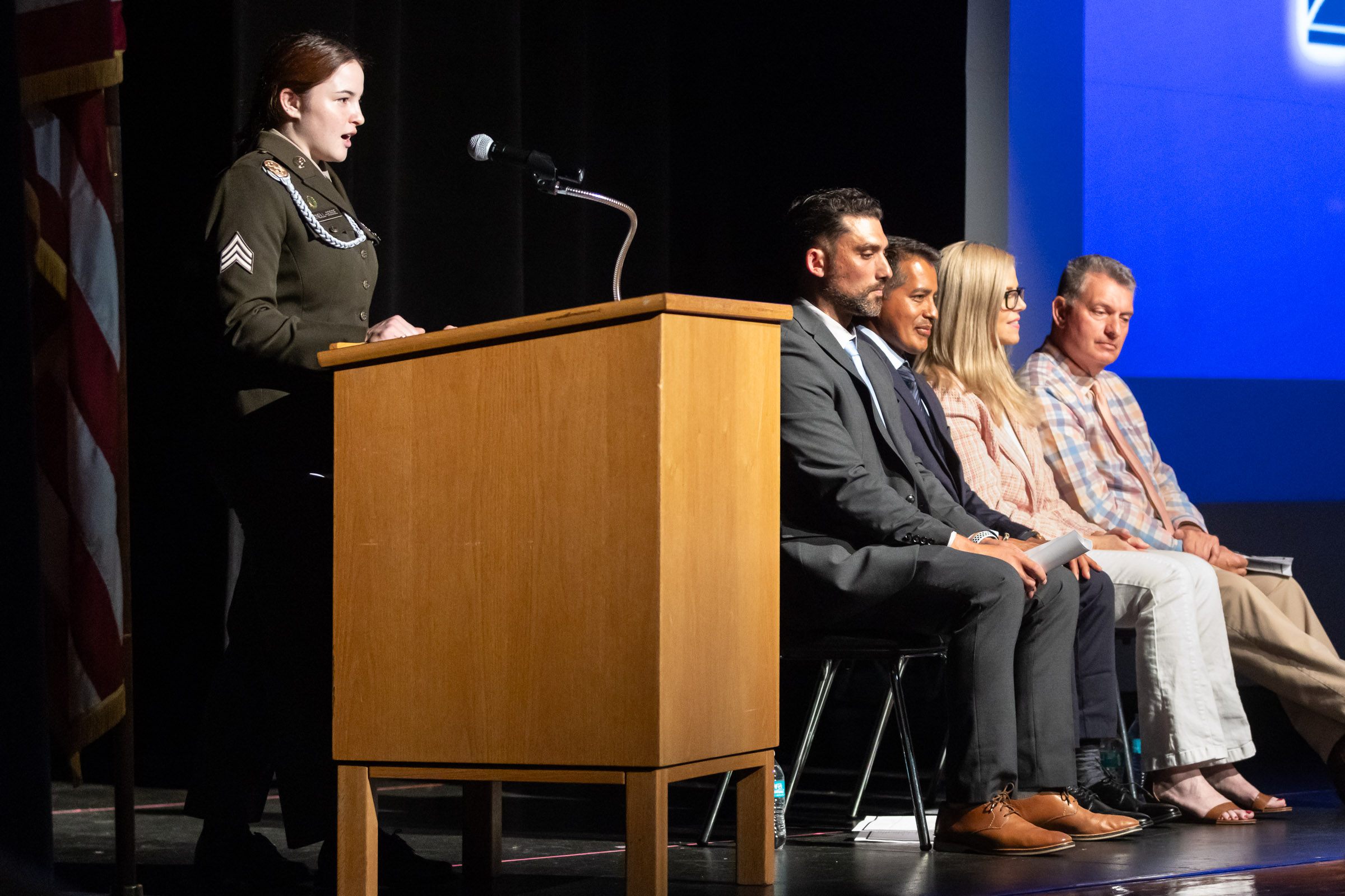 A former student, now in the military, speaks at the podium during the Warwick Valley High School Career and Technical Education Recognition Ceremony and Honor Society Induction