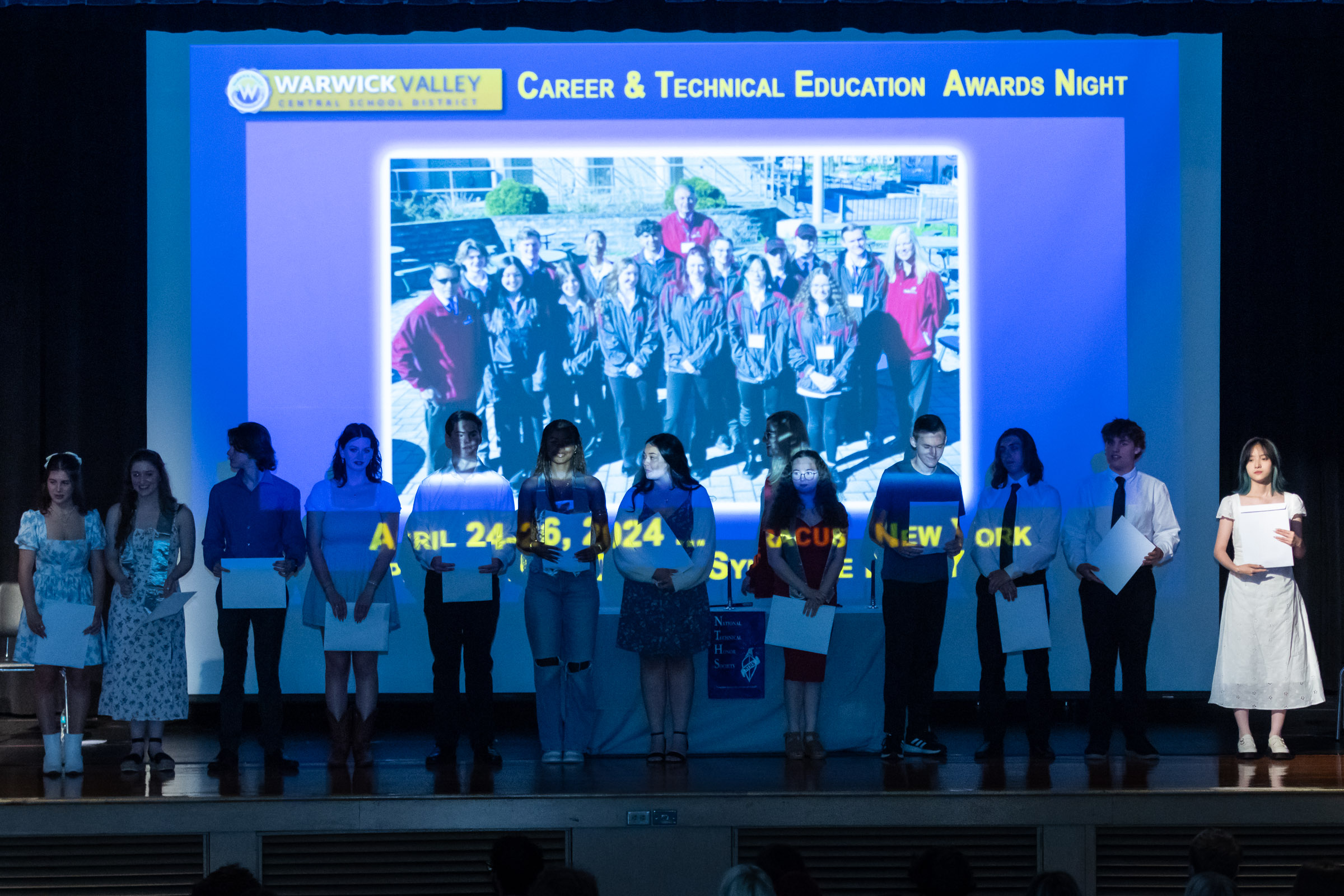 Students stand on the stage with their awards during the Warwick Valley High School Career and Technical Education Recognition Ceremony and Honor Society Induction