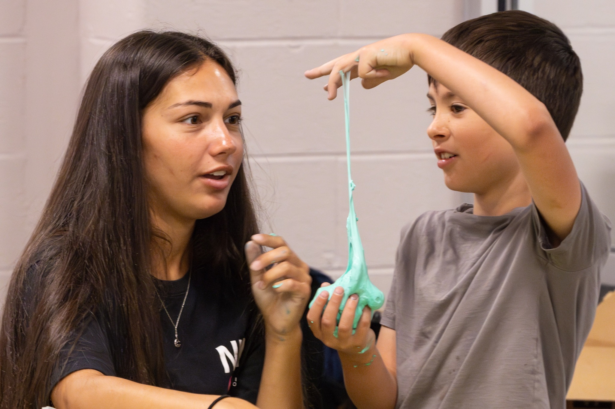 A Warwick Valley High School AP calculus class member helps a Sanfordville Elementary School PIE 3-4 students with a STEM projects.