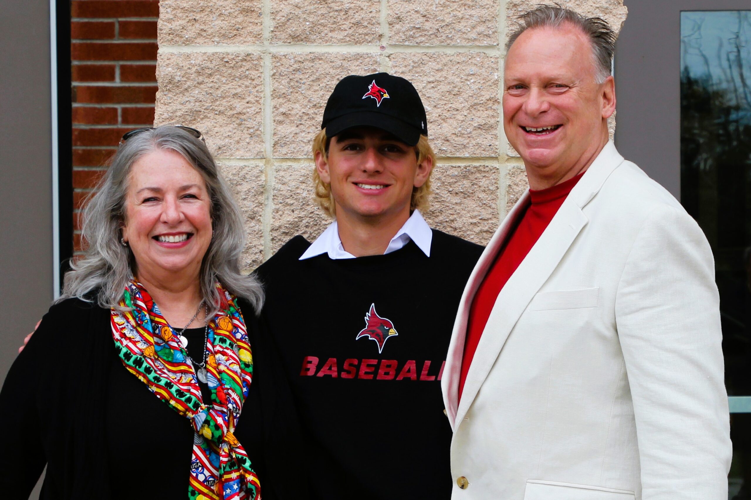 Warwick Valley High School athlete poses with family members after signing a national letters of intent to play sports in college.