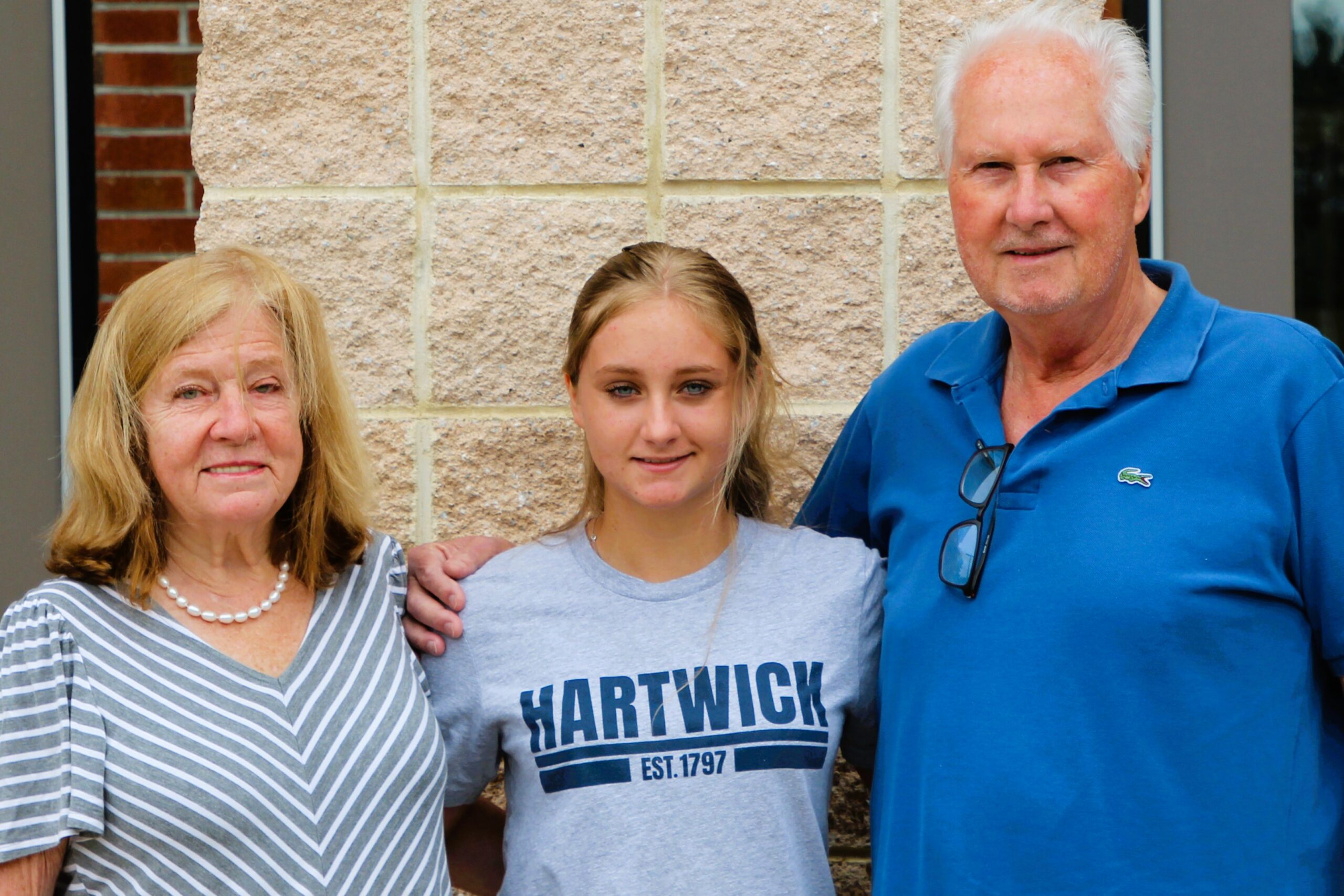 Warwick Valley High School athlete poses with family members after signing a national letters of intent to play sports in college.