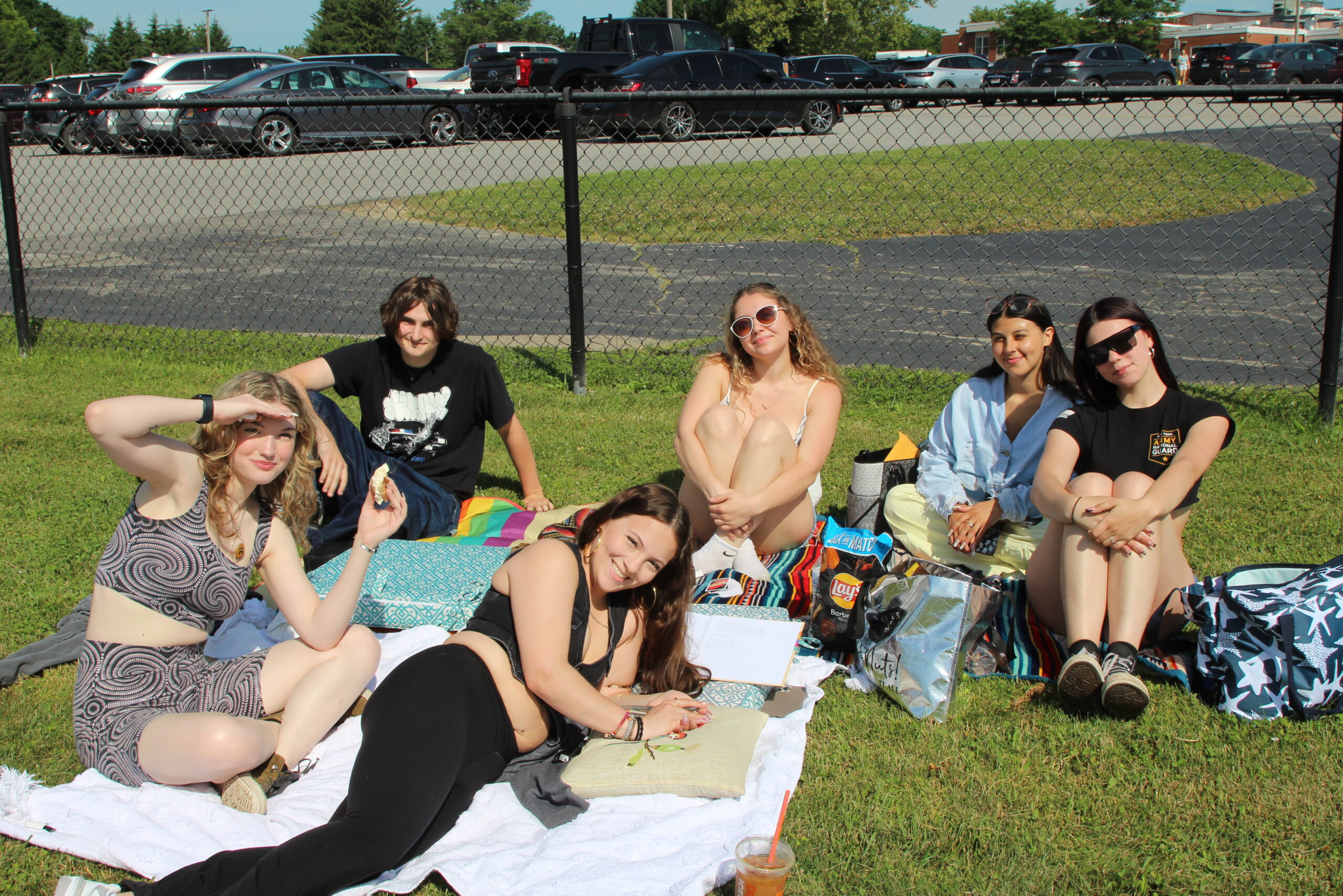 Warwick Valley High School seniors sit on blankets on the grass during their Senior Picnic