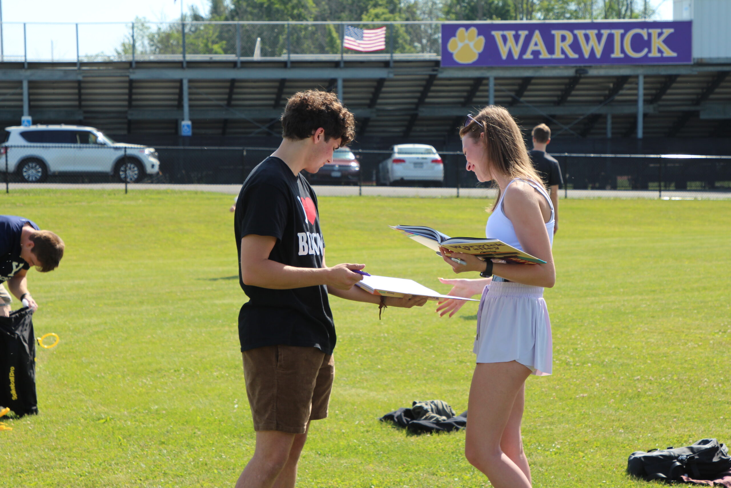 Warwick Valley High School seniors sign yearbooks during their Senior Picnic