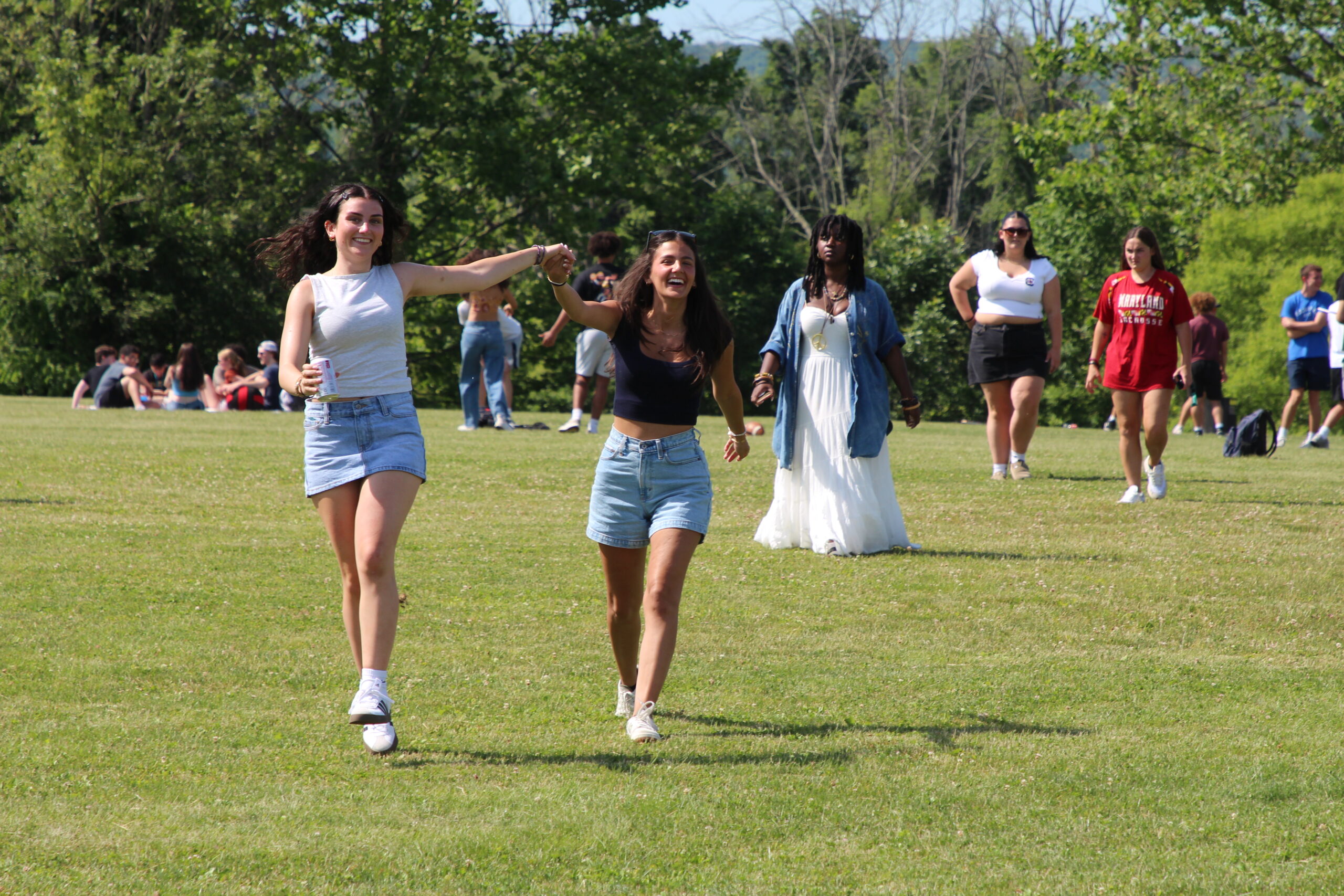 Warwick Valley High School seniors smile and hold hands during their Senior Picnic