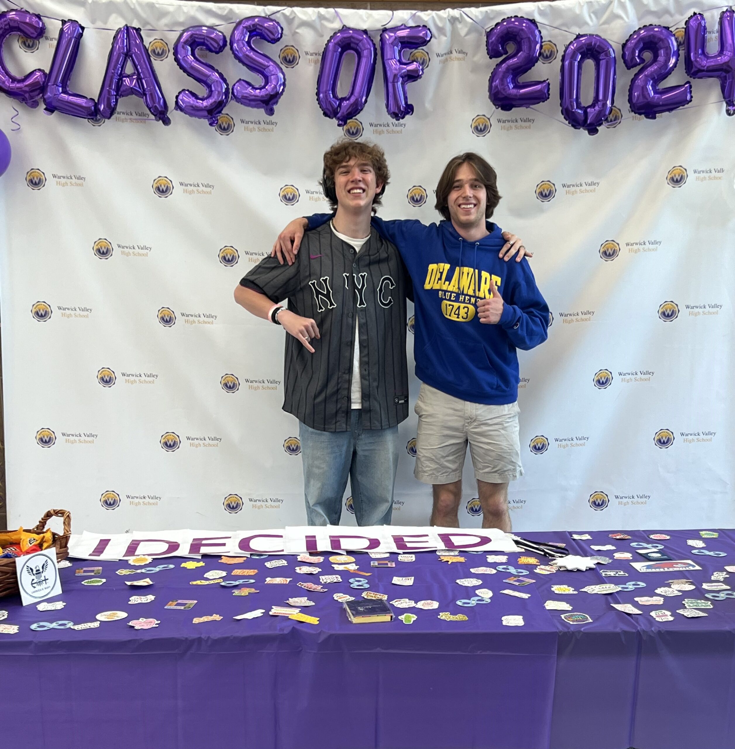 Two WVHS seniors stand under balloons reading "Class of 2024" on Decision Day, celebrating the Class of 2024 and the choices they’ve made about their post high school lives.