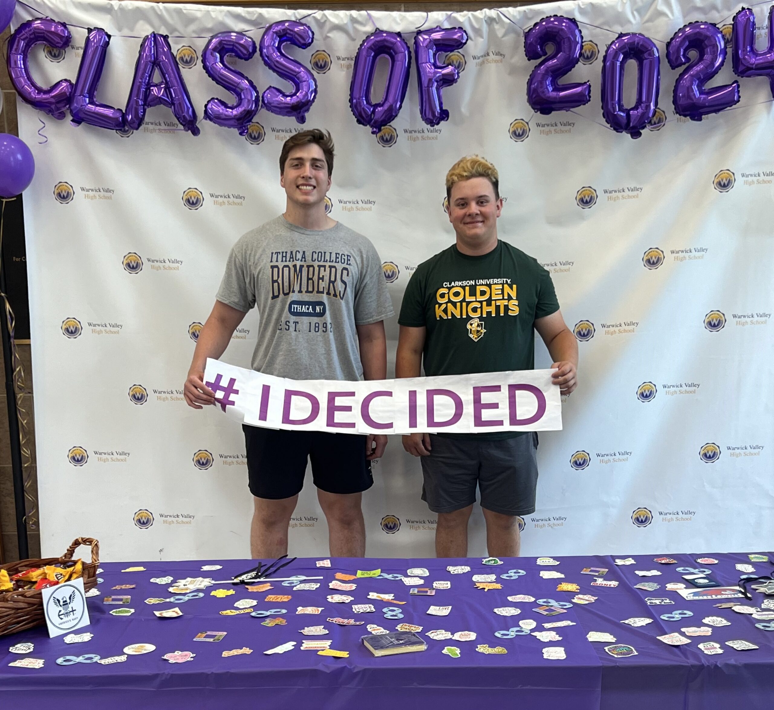 Two WVHS seniors hold an "I DECIDED" banner on Decision Day, celebrating the Class of 2024 and the choices they’ve made about their post high school lives.