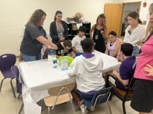 group of people sitting around table