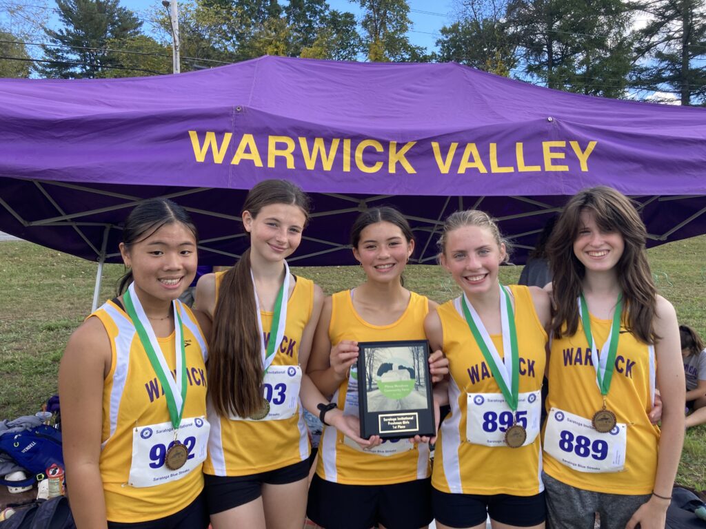 Warwick girls cross country freshman with their medals.