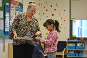 student and teacher in classroom