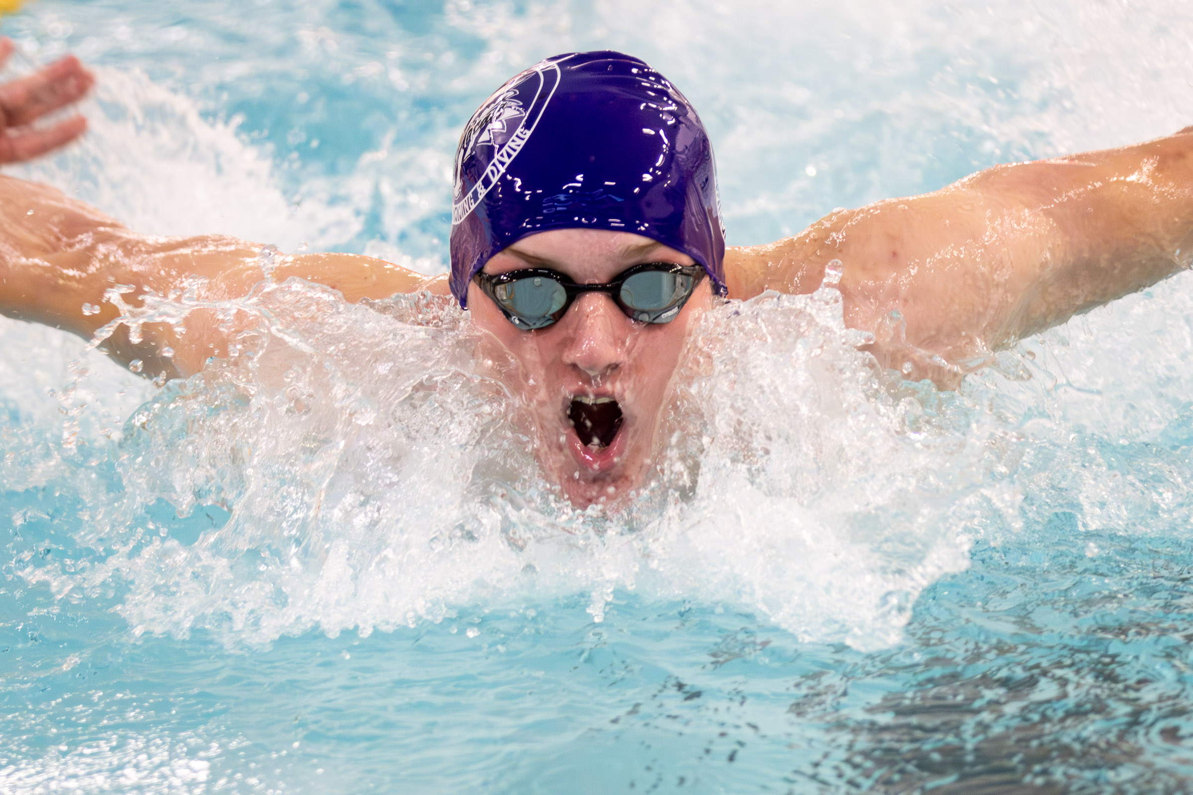 Warwick swimmer competes in a varsity meet against Goshen.