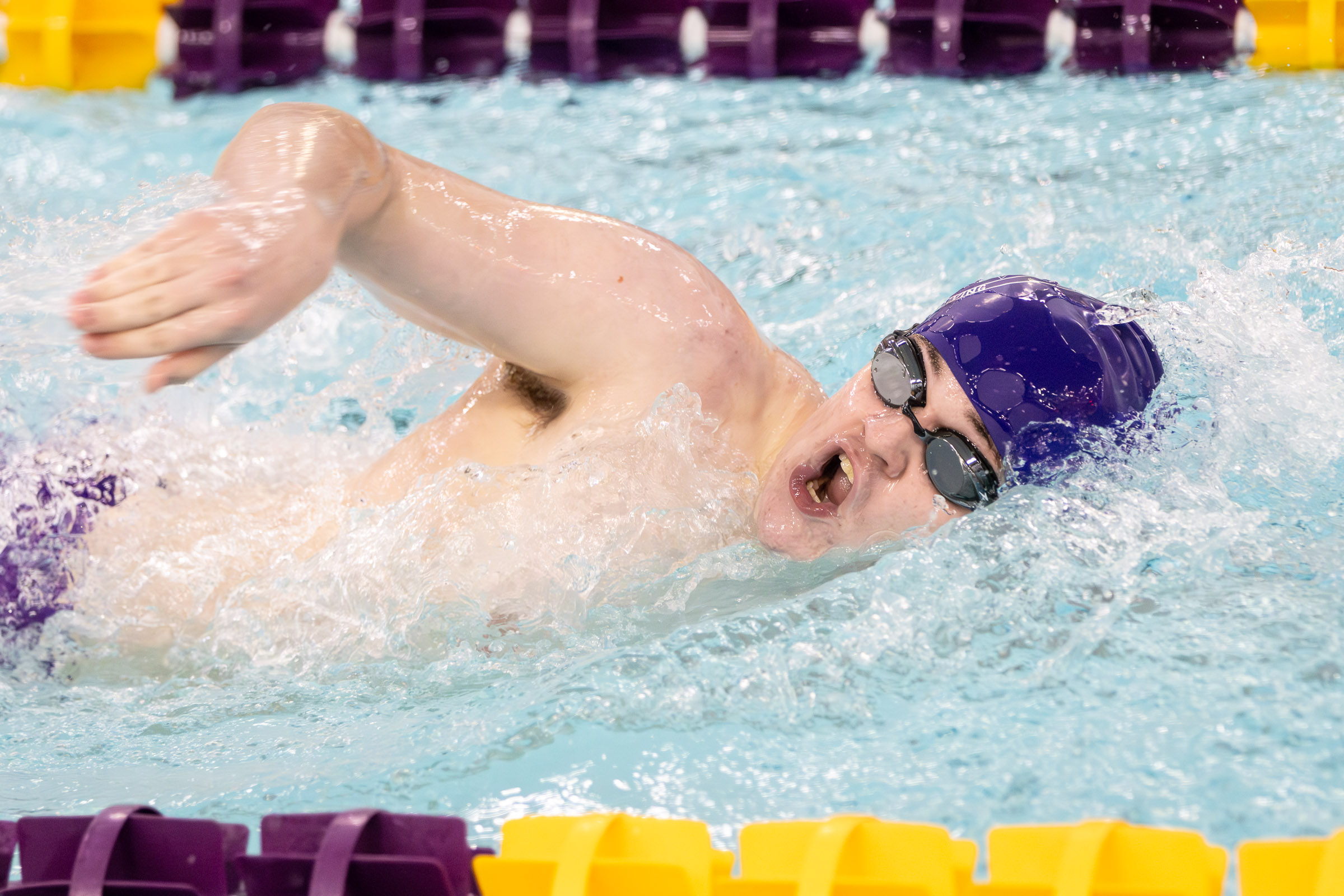 Warwick swimmer competes in a varsity meet against Goshen.