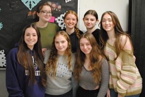 The seven-member Global Engagement Club poses for a group photo.