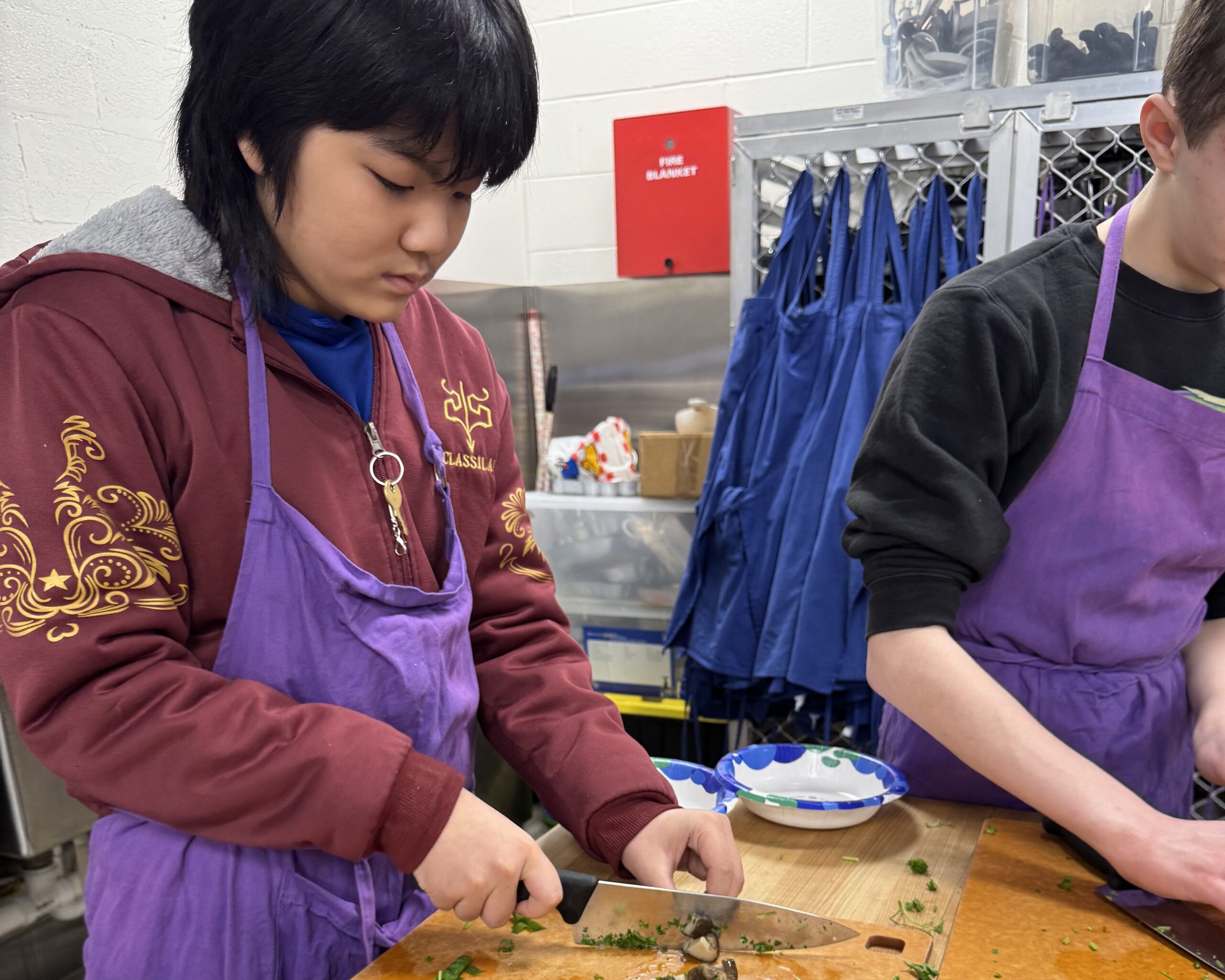 Students in Ms. Ping's Mandarin Chinese class prepare wontons.