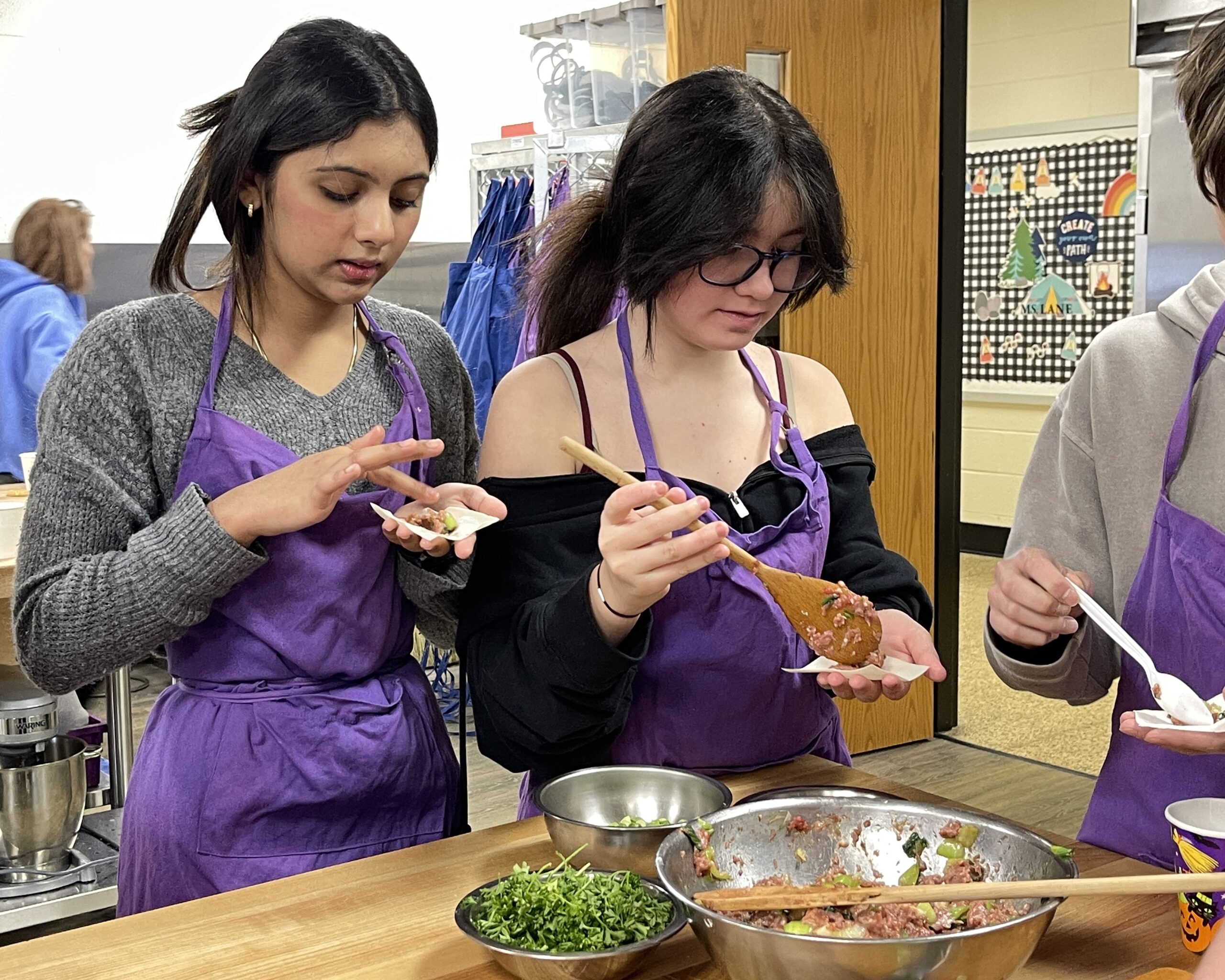 Students in Ms. Ping's Mandarin Chinese class prepare wontons.