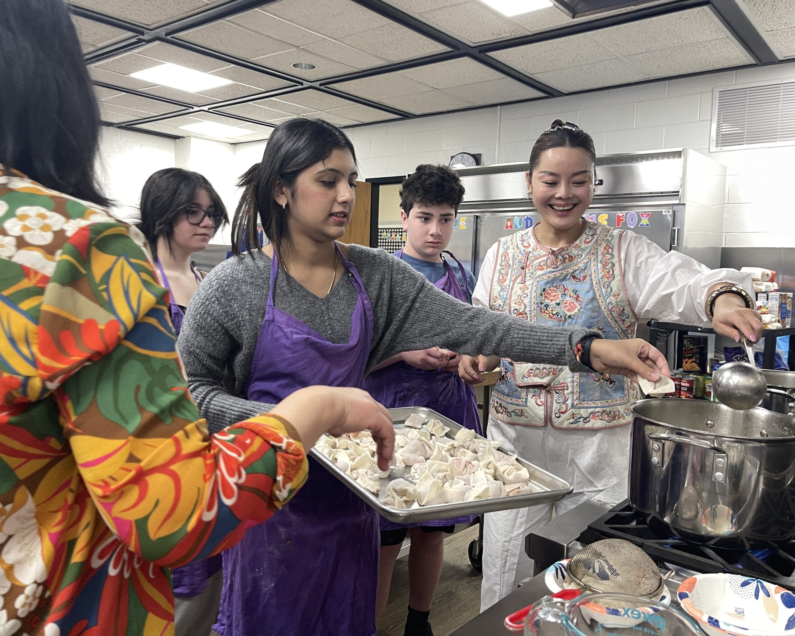 Students in Ms. Ping's Mandarin Chinese class prepare wontons.